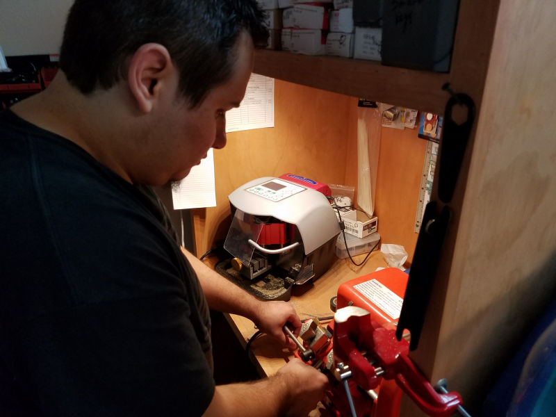A locksmith using specialized tools