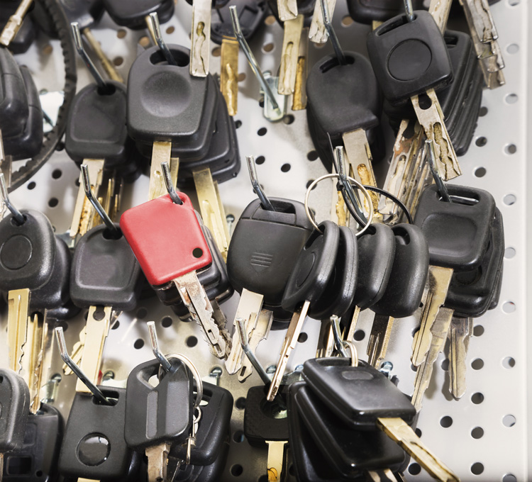 A collection of keys hanging on a rack