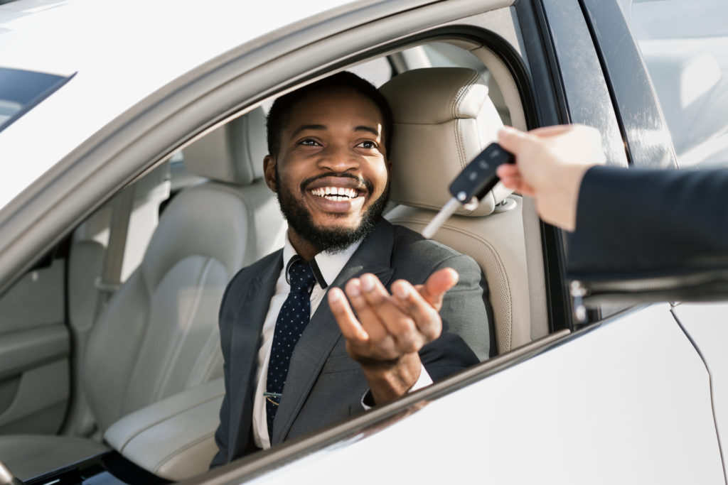 Man being handed new set of laser cut car keys