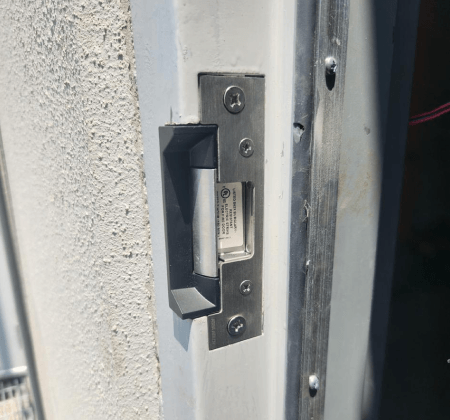Residential locksmith in Abilene TX installing electric strike locks