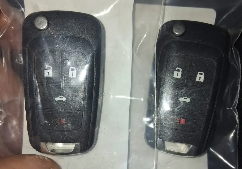 Two flip key fobs programmed by a mobile automotive locksmith in Texas