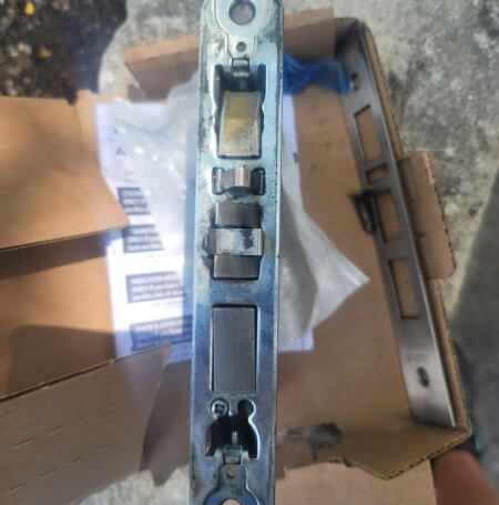 Emergency locksmith repairing internal door lock mechanism Austin TX