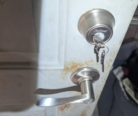 Deadbolt lock installation with keys on a residential door by Killeen Locksmith
