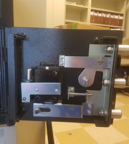 Emergency locksmith in Bryan, TX opening a commercial safe after a lockout