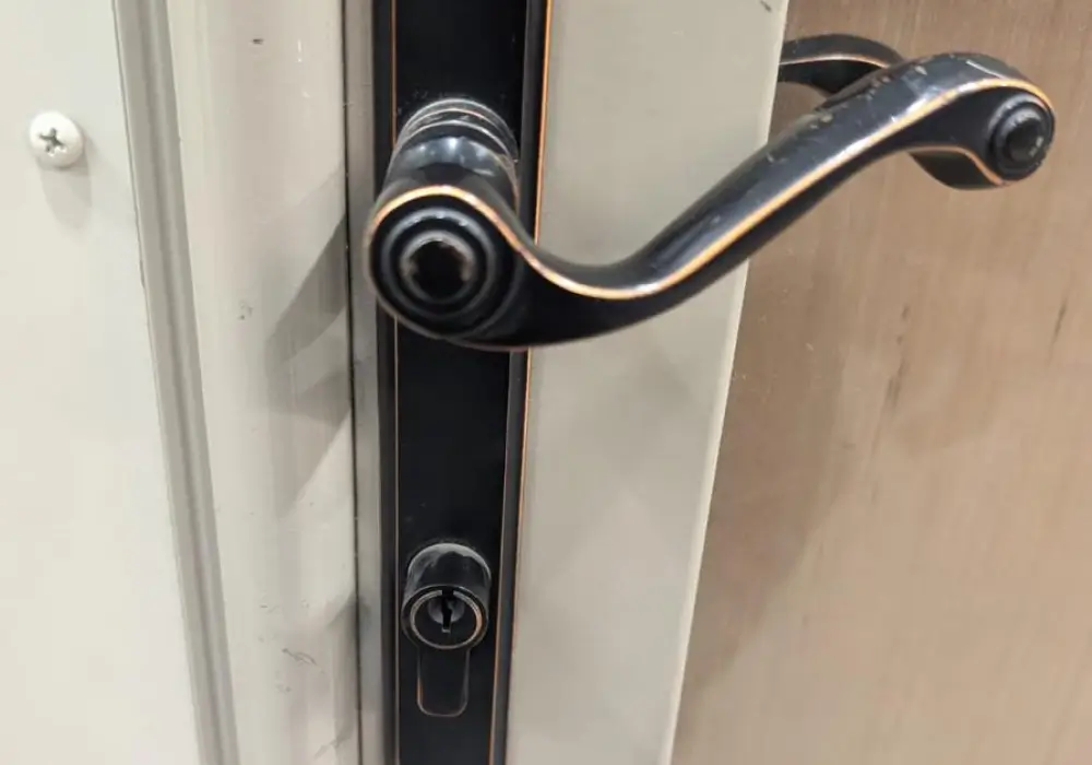House front door with keyed lock cylinder