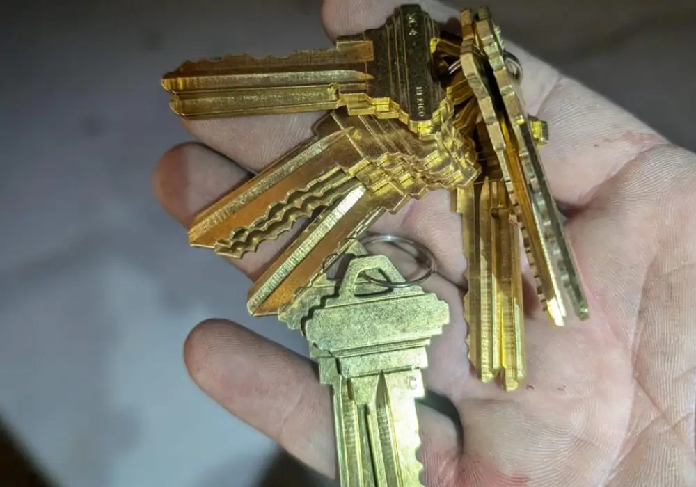 Locksmith holding newly cut residential house keys