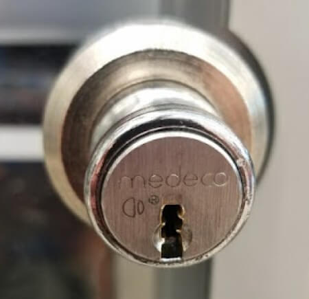 Medeco high security lock installed on a commercial door in Temple, TX