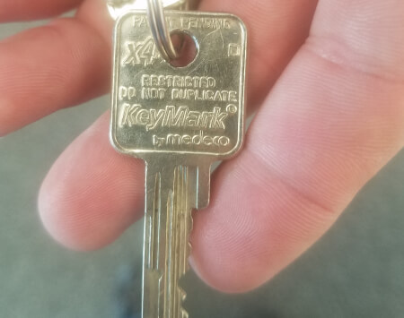 Restricted key marked Do Not Duplicate for high security lock installation in Dallas, TX