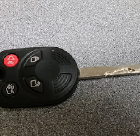 Worn Ford remote head key with damaged blade that can break in ignition